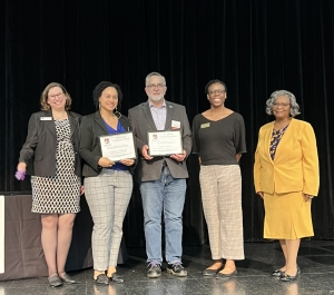 Outstanding Community Partners receiving awards on stage