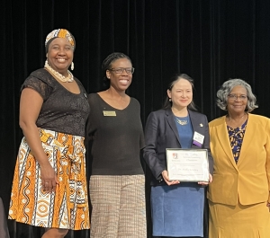 Outstanding Service-Learning Champion Award recipient with award