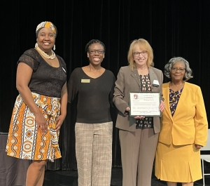 Leadership in Community Engagement award recipient with award