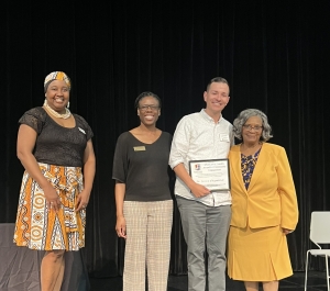 Mid-Career Faculty Award recipient with award
